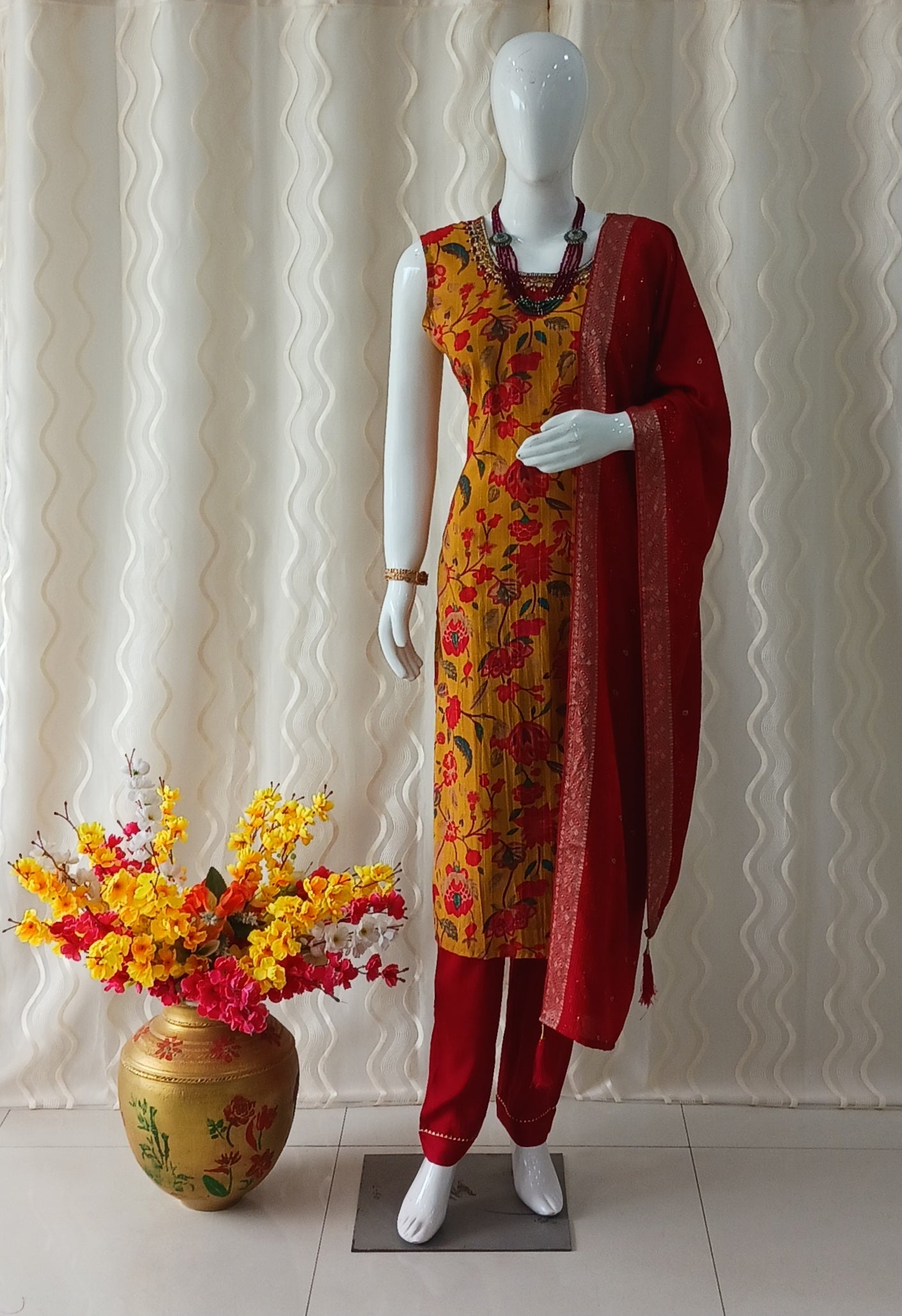 Yellow Straight Cut 3 - Piece Suit with Duppatta and Sleeveless with Attached Sleeves.