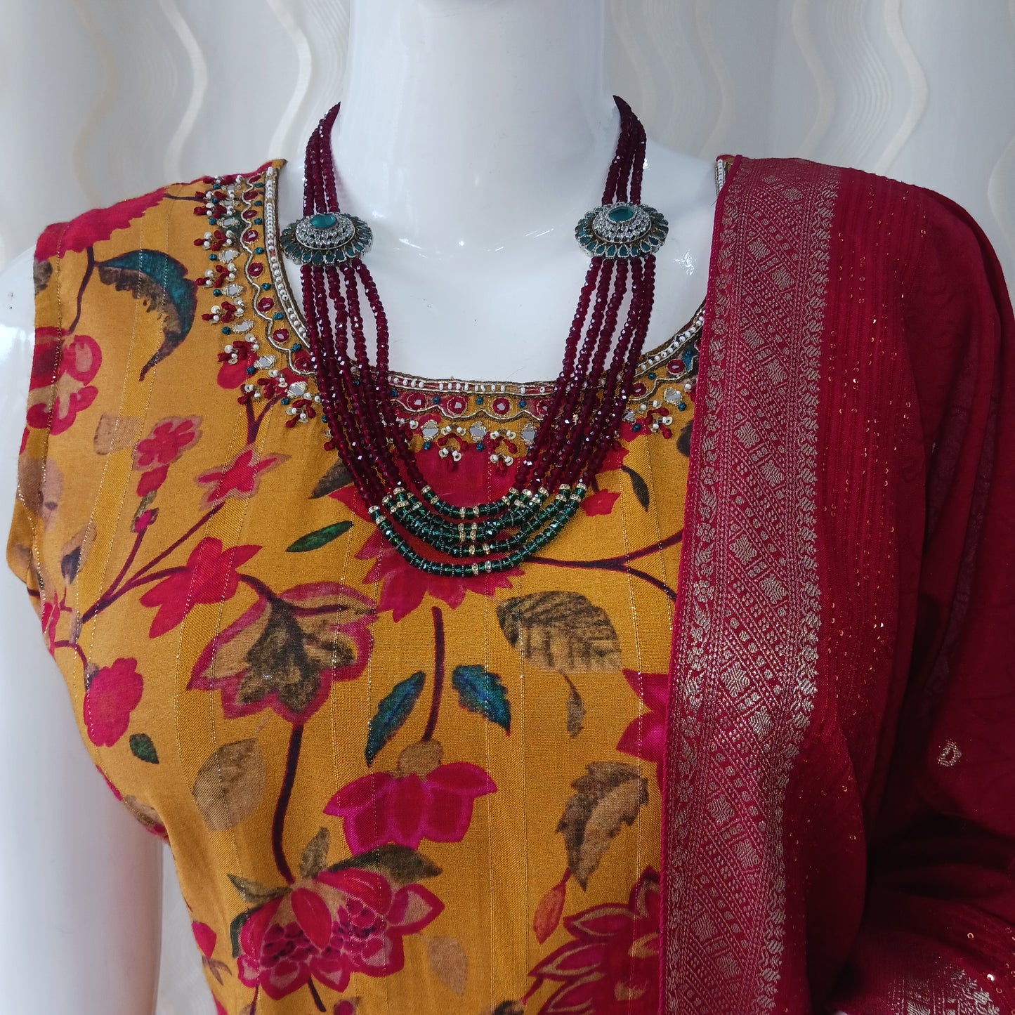 Yellow Straight Cut 3 - Piece Suit with Duppatta and Sleeveless with Attached Sleeves.