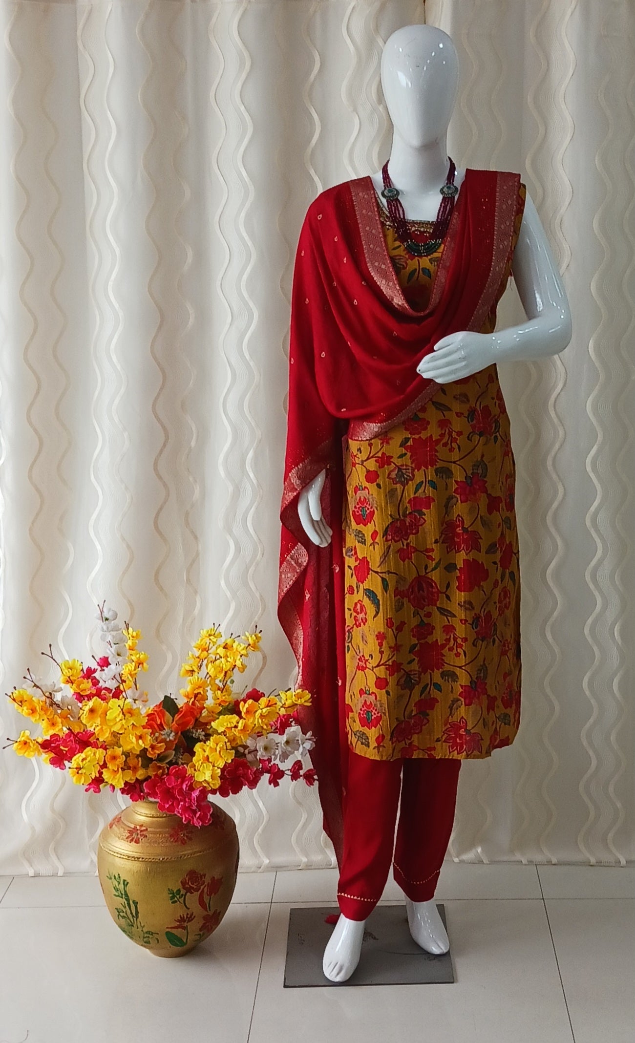 Yellow Straight Cut 3 - Piece Suit with Duppatta and Sleeveless with Attached Sleeves.