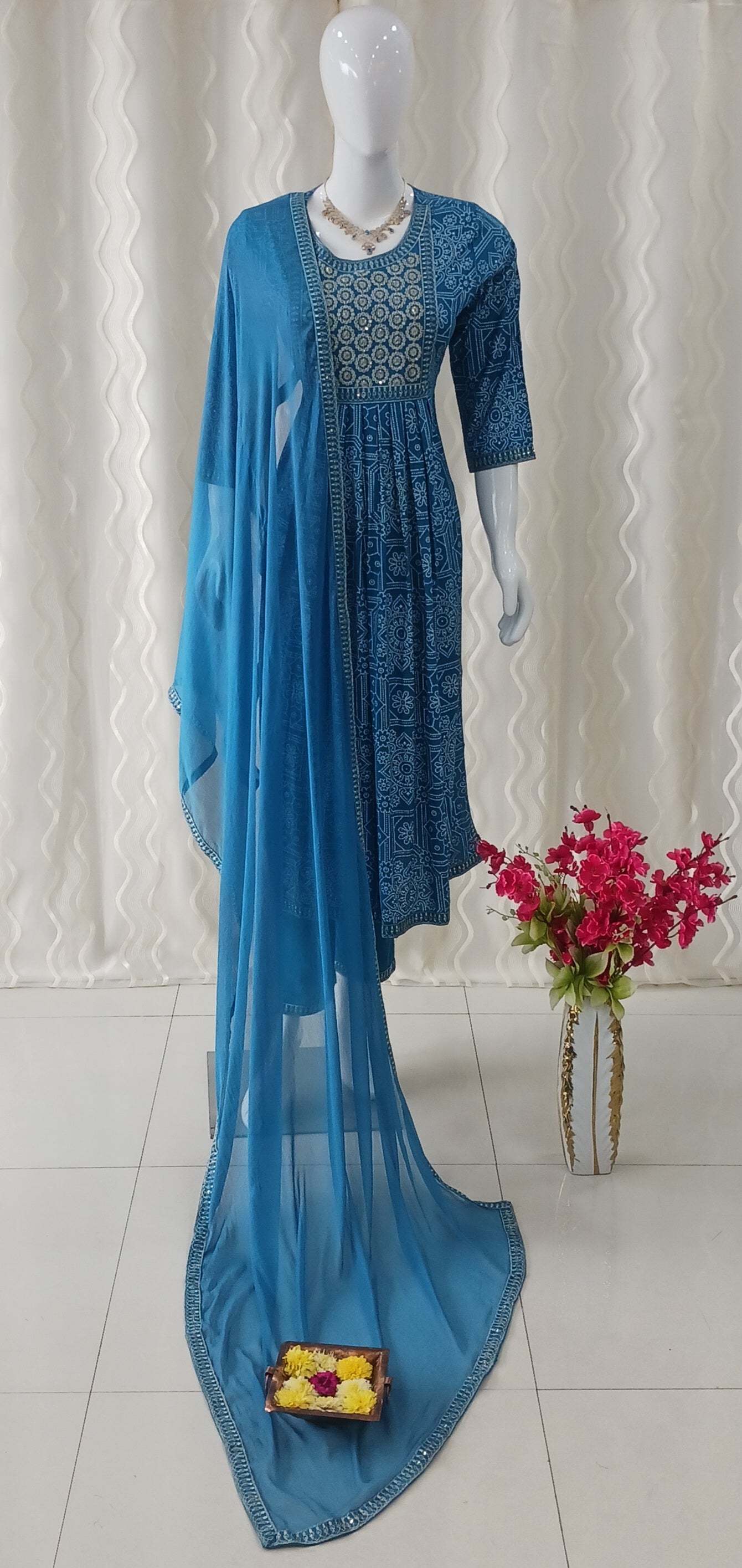 Blue Straight Cut 3 - Piece Suit with Duppatta and Sleeveless with Attached Sleeves.