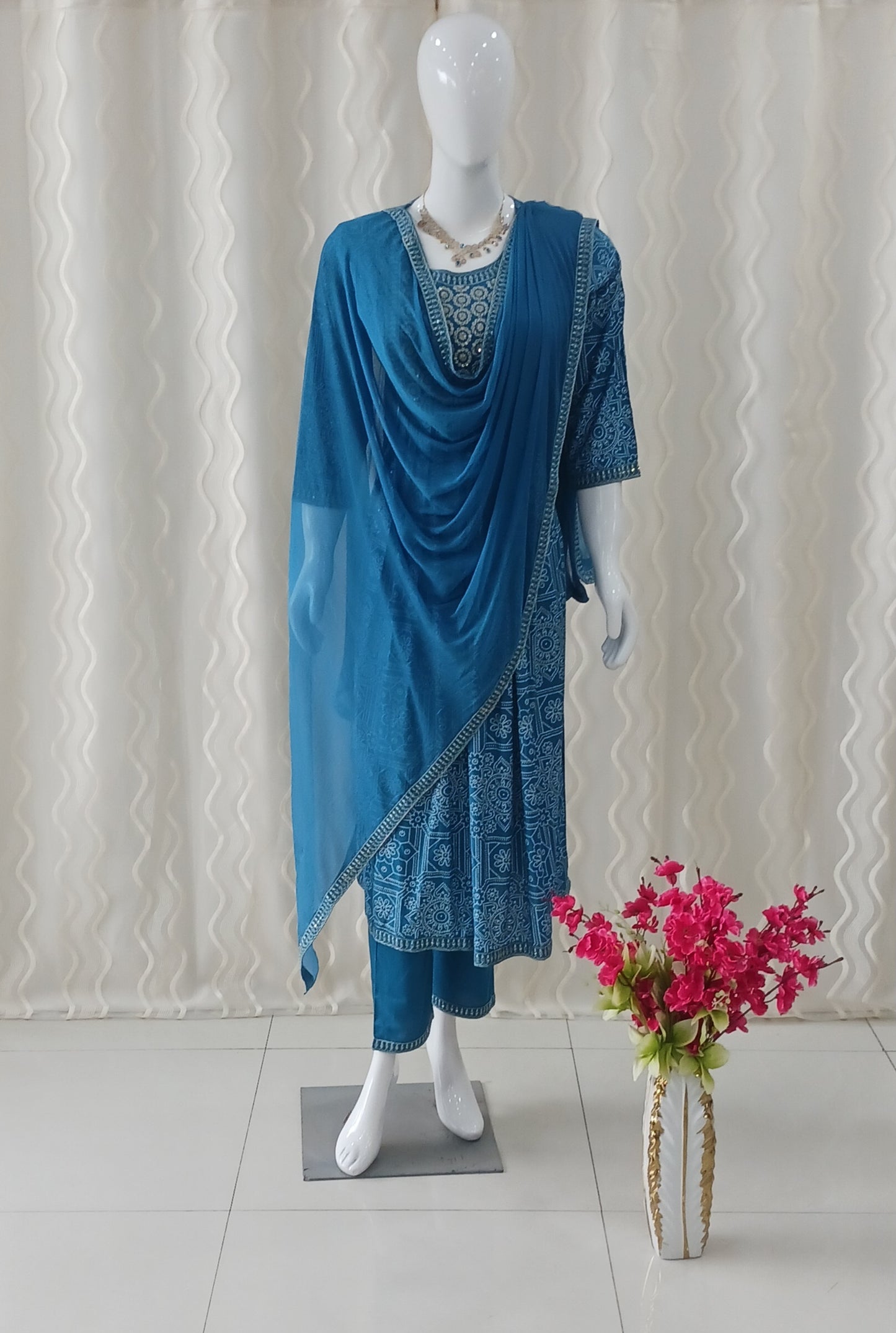 Blue Straight Cut 3 - Piece Suit with Duppatta and Sleeveless with Attached Sleeves.