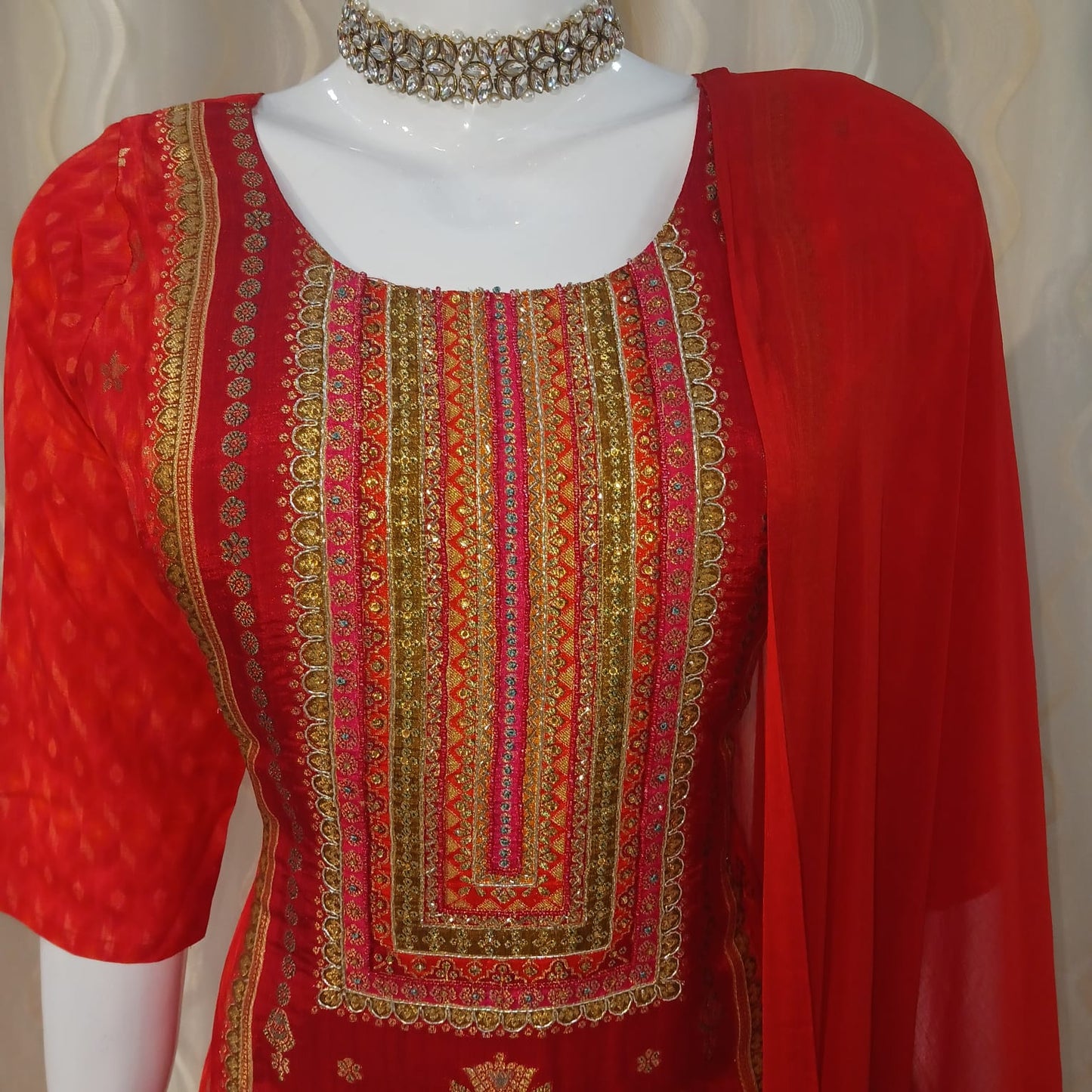 Red Straight Cut 3-piece suit with Contrast Work Dupatta with sleeves attached.