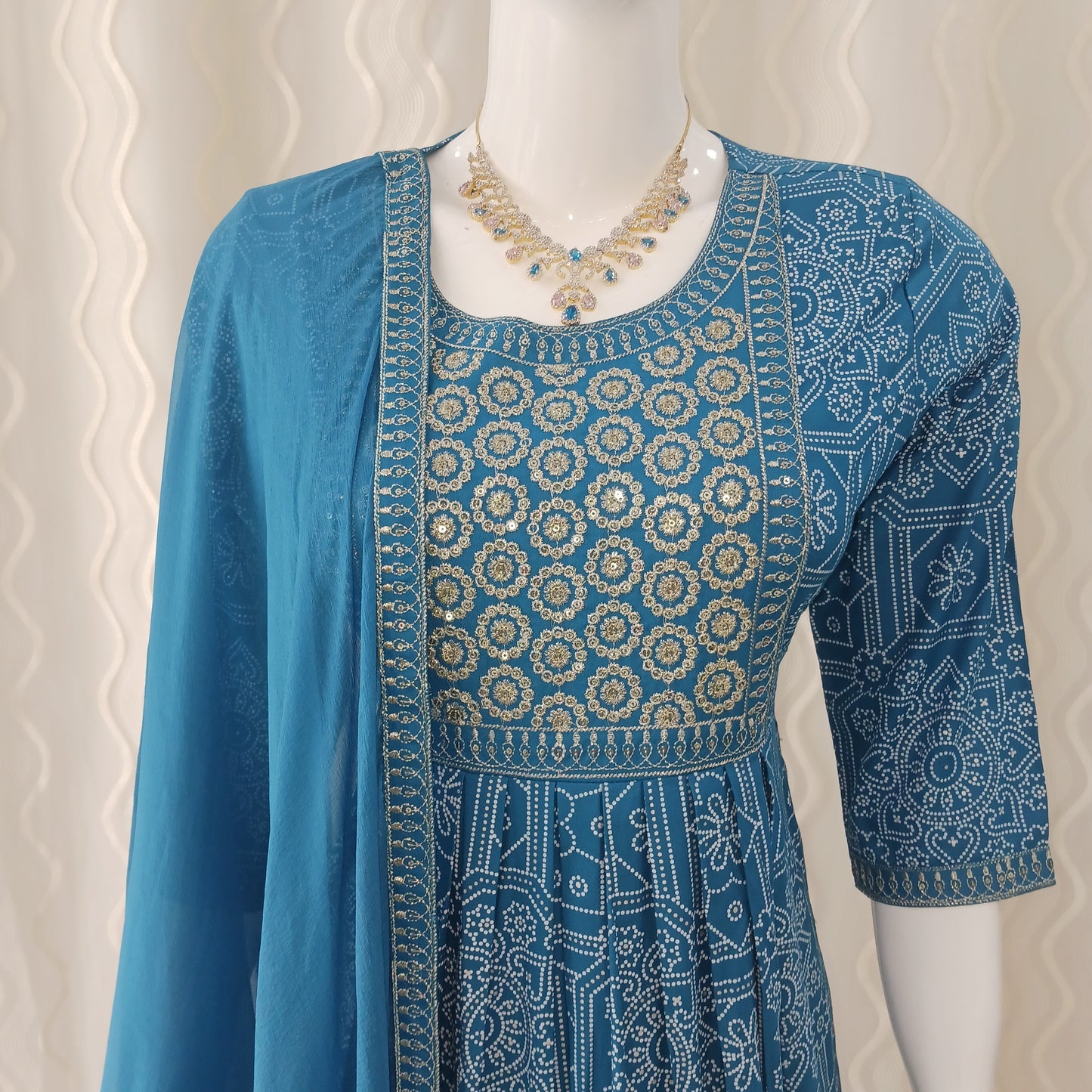 Blue Straight Cut 3 - Piece Suit with Duppatta and Sleeveless with Attached Sleeves.